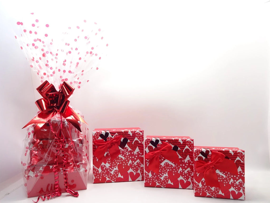 Flatlay of Max Factor lipsticks, mascara, palette, and beauty items beside makeup bag and nail polishes