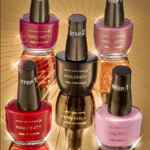Styled display of Max Factor Nailfinity Leading Lady 230 with other shades and Gel Top Coat on gold reflective surface