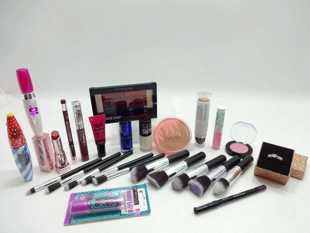 Close-up of Maybelline 15pc makeup collection with brushes, lipstick, mascara, bronzer, and palette
