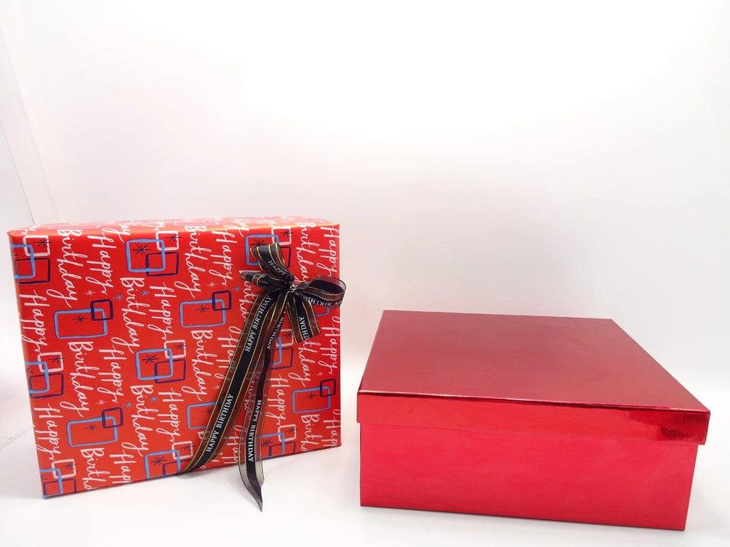 Beautiful Maybelline birthday makeup gift set wrapped with happy birthday design paper and bow