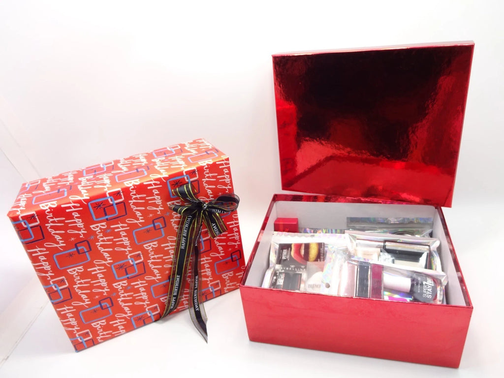 Open Maybelline birthday gift box with 26 beauty items and accessories neatly displayed