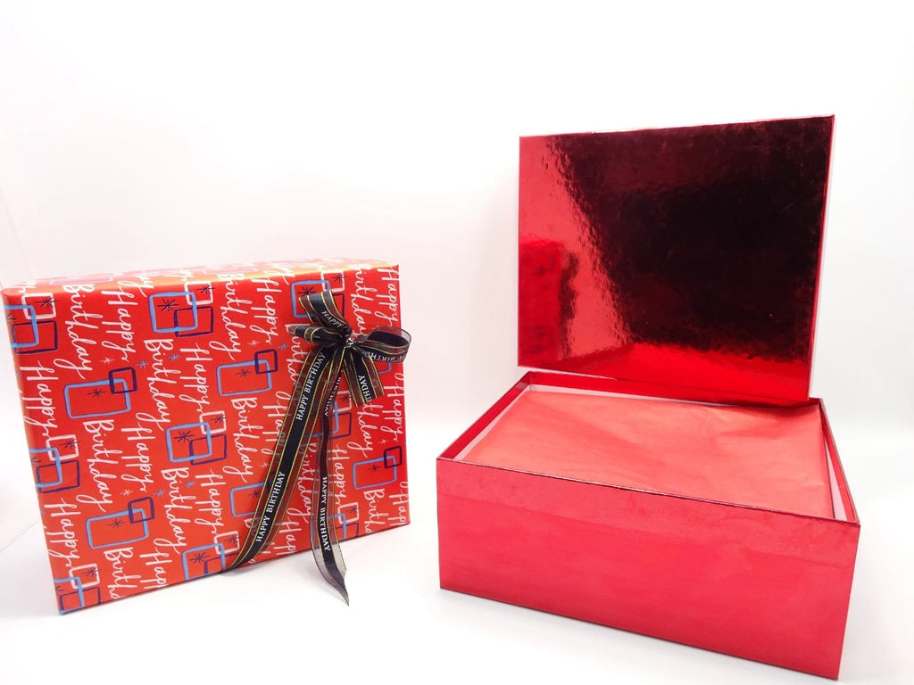 Maybelline 26pc birthday beauty box with red lid open and wrapped items inside