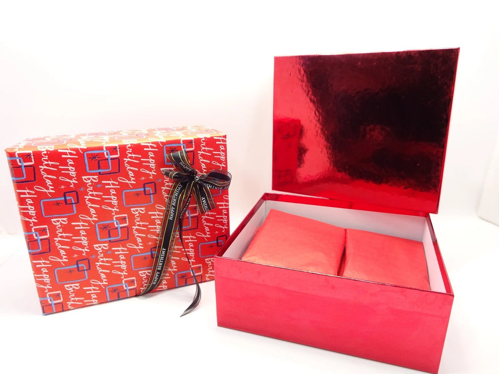 Maybelline birthday makeup gift box with products tissue wrapped inside red box