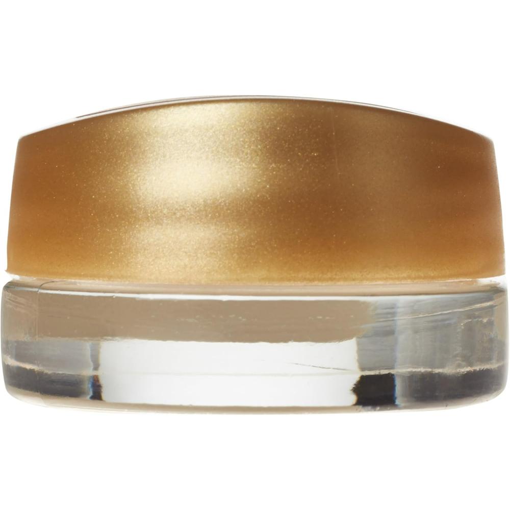 Side view of Maybelline Dream Mousse Eye Color in 13 Divine Gold, highlighting the gold cap and clear glass container.