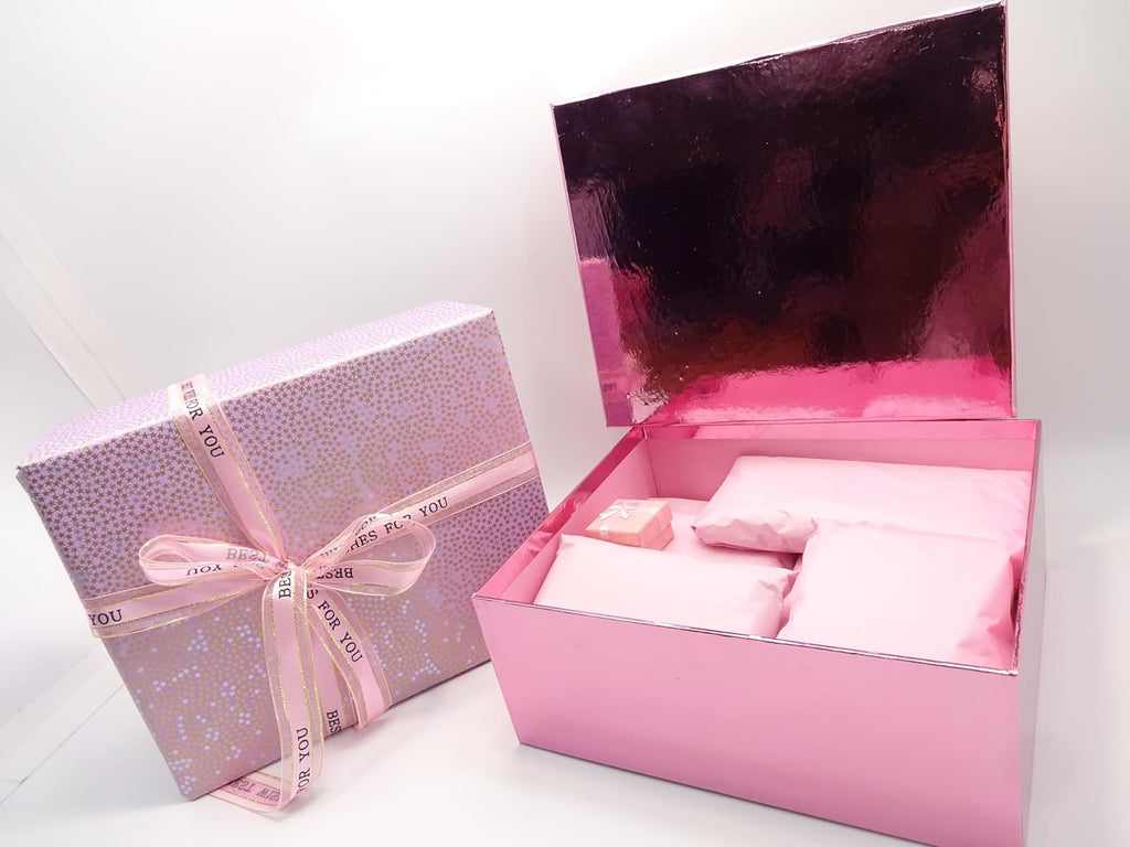 Opened pink gift box showing neatly wrapped Maybelline cosmetic items