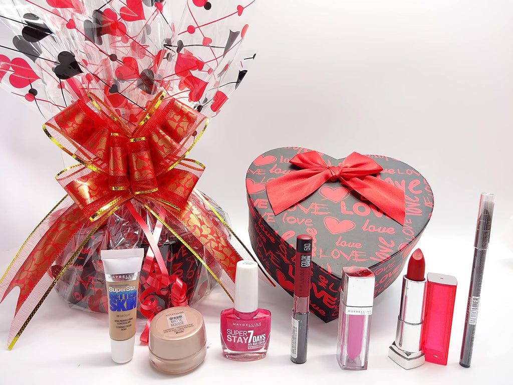 Unwrapped Maybelline makeup gift hamper with makeup products and red-themed gift packaging.