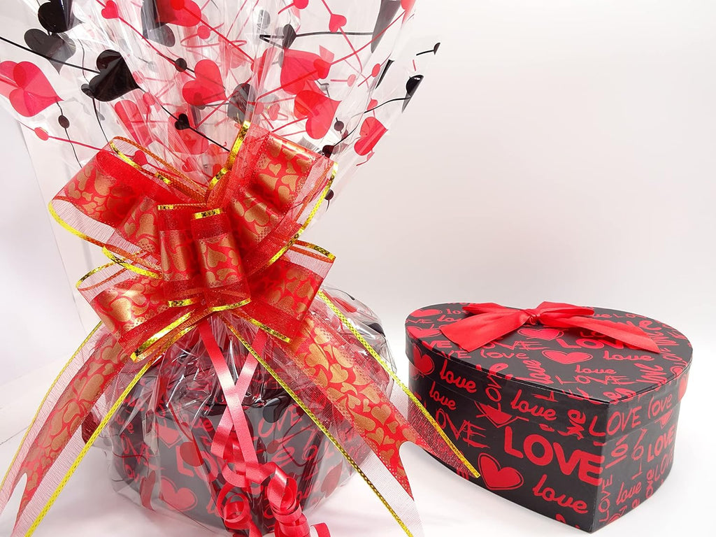 Closed love-themed heart-shaped gift box featuring a red ribbon for a romantic touch.