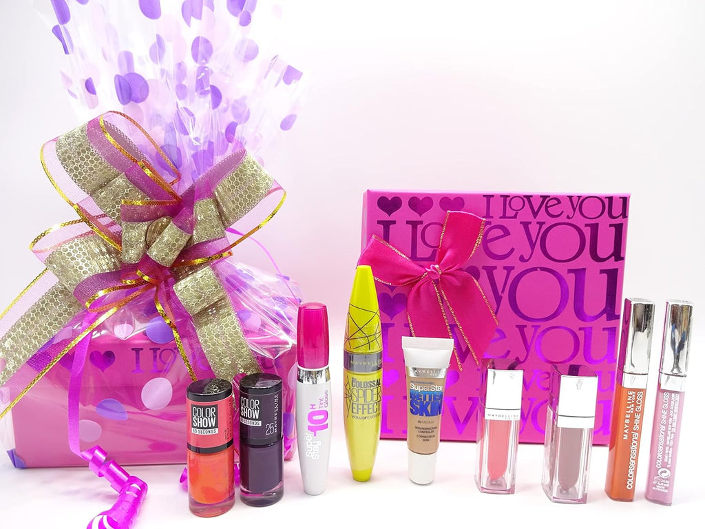 A vibrant purple and gold wrapped Maybelline gift hamper, featuring a large bow and polka dot design.