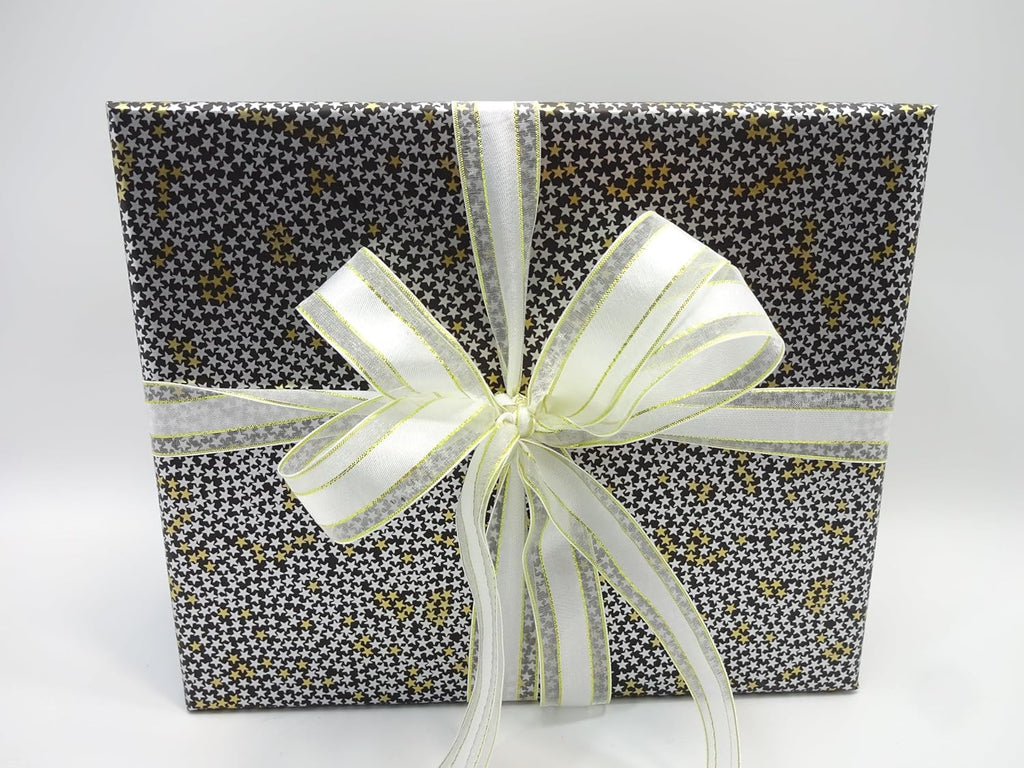 Front view of No7 men’s Father’s Day gift box with gold and white star wrapping and white ribbon bow