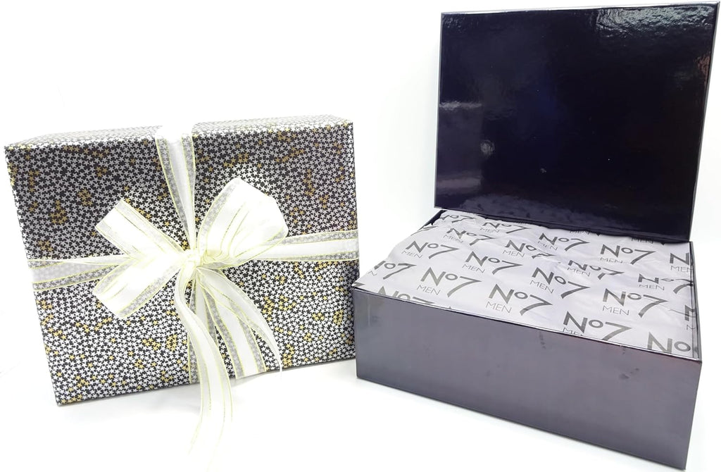 No7 gift box opened showing No7 Men branded tissue wrapping inside the black luxury box