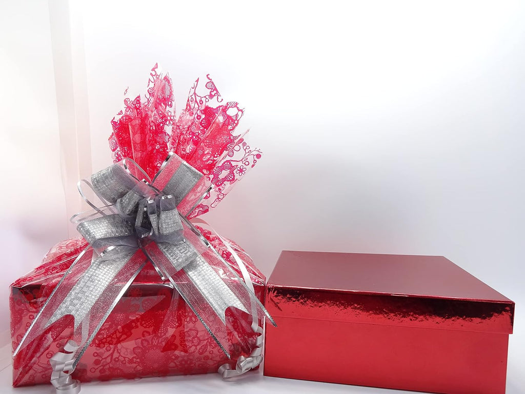 Side view of the luxury gift-wrapped box with red lace details and silver ribbon.