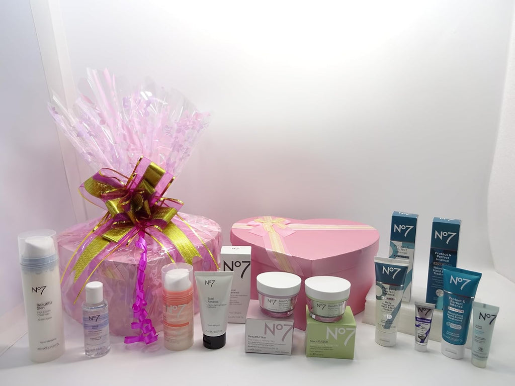 Luxury No.7 Ultimate Skincare Gift Hamper wrapped with pink cellophane and a gold-pink ribbon bow.