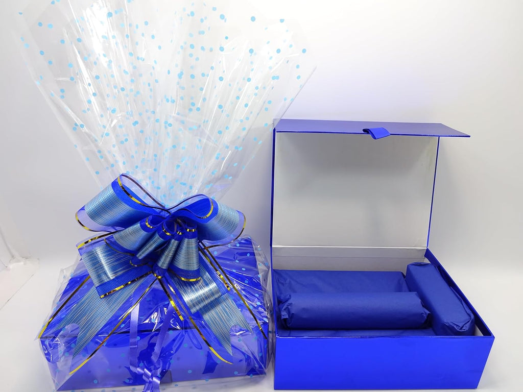 Open blue gift box showing neatly arranged items wrapped in royal blue tissue paper