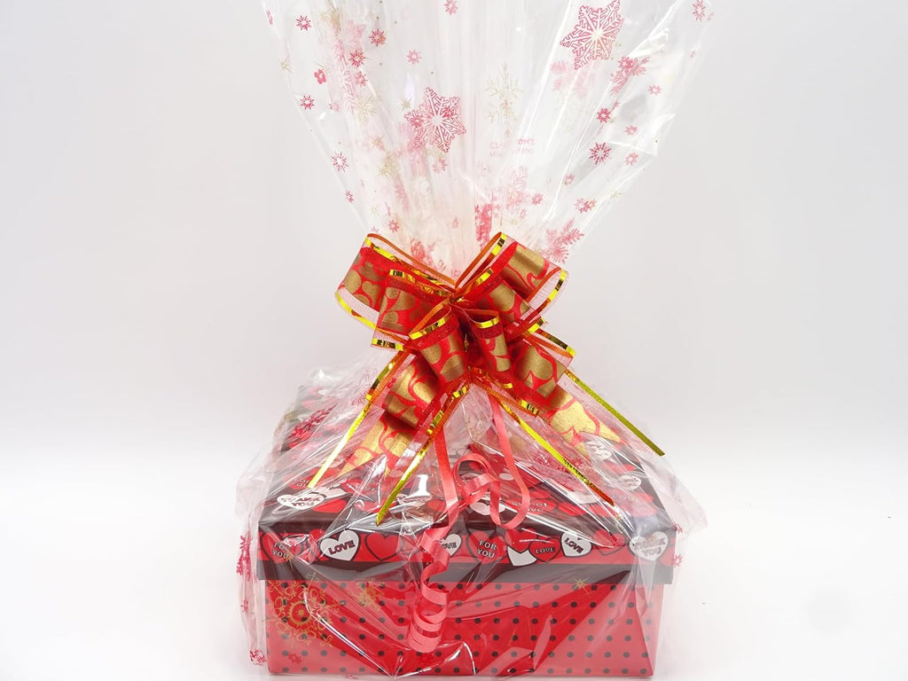 Rimmel gift box closed with a bold red bow, featuring polka-dot accents and heart designs for a festive touch