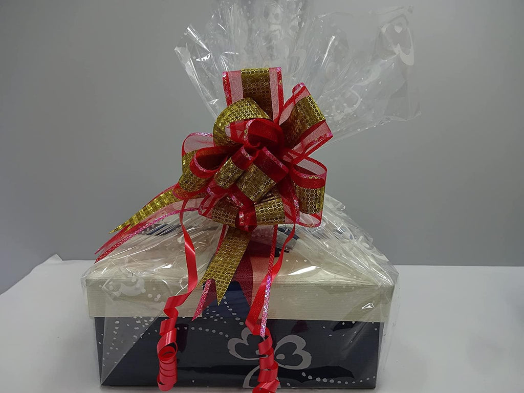 The wrapped gift hamper featuring a red and gold bow, ready to impress.