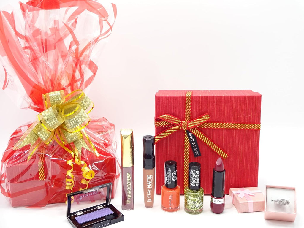 Rimmel London Beauty Gift Box Hamper wrapped in vibrant red cellophane with a golden bow.