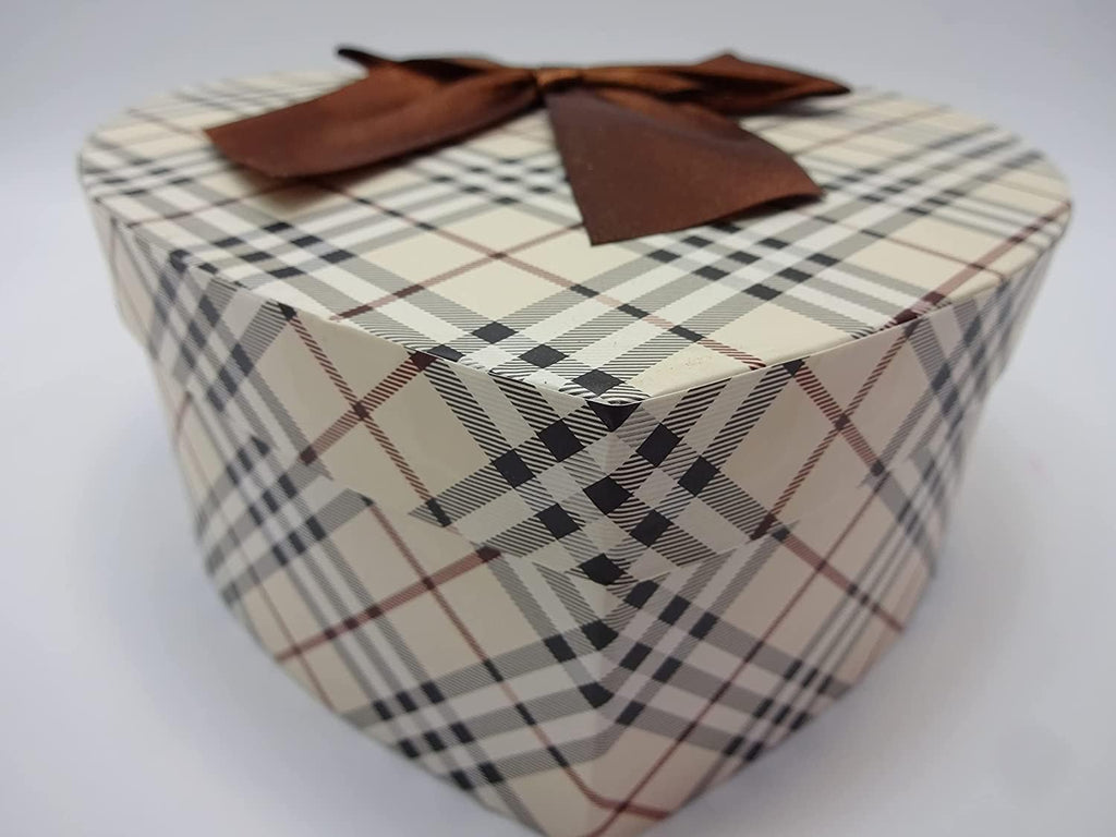 Heart-shaped gift box with brown ribbon in classic plaid pattern for Rimmel London beauty bundle