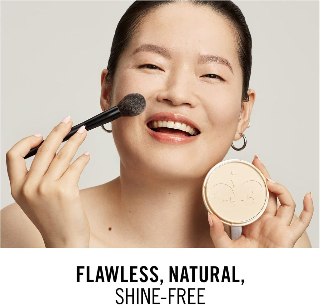 Model applying Rimmel Stay Matte Powder 002 Pink Blossom for natural shine-free finish