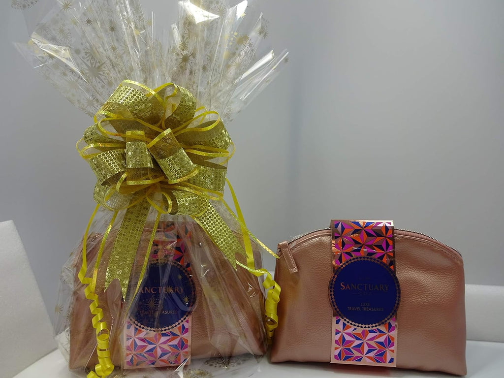 Sanctuary Spa Luxe Travel Treasures gift set beautifully wrapped with a golden bow and cellophane for gifting occasions