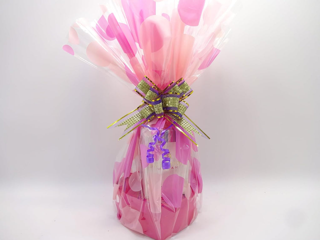 Close-up of Superior Woman Perfume Gift Hamper wrapped in pink cellophane with ribbon