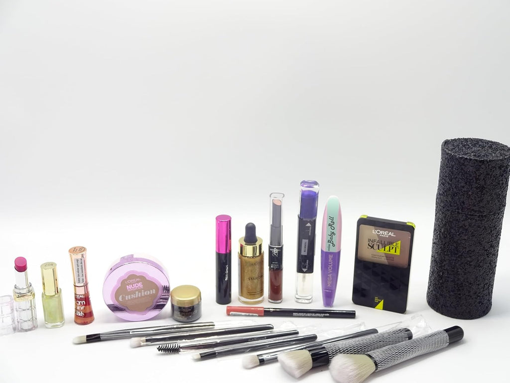 Full display of makeup items including luxury brush set, contour palette, mascara, and lipsticks from the gift box