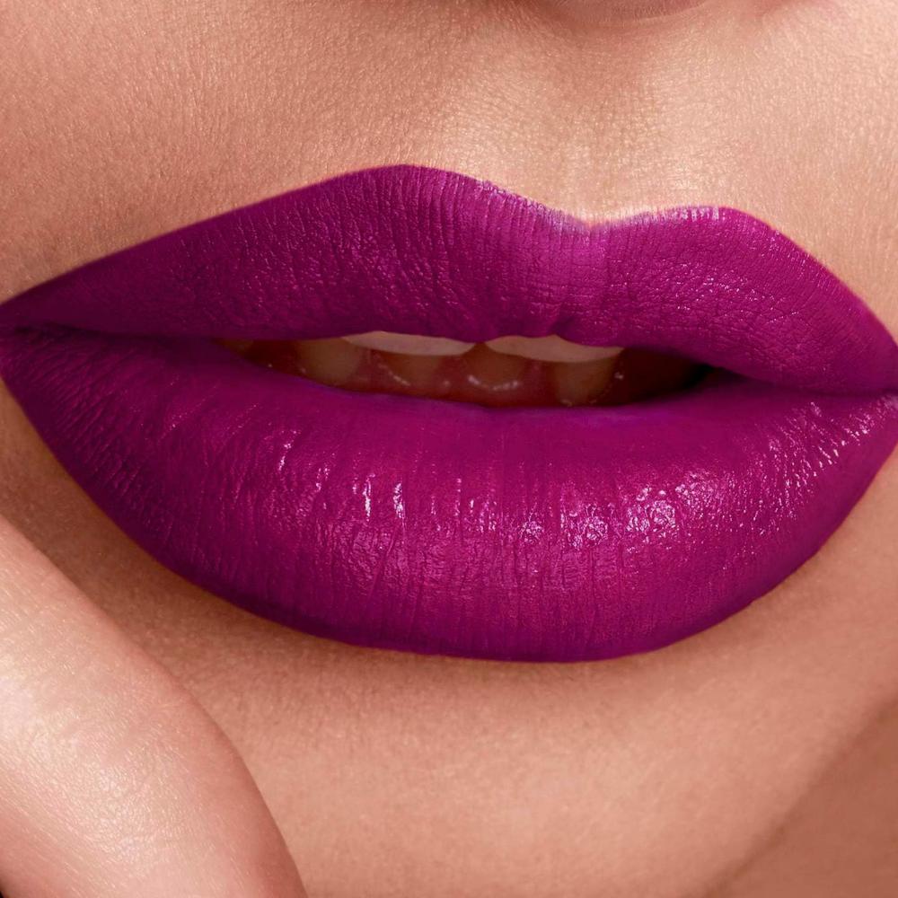 Close-up of lips wearing Maybelline 365 Plum Passion Lipstick, vibrant plum color with a smooth finish