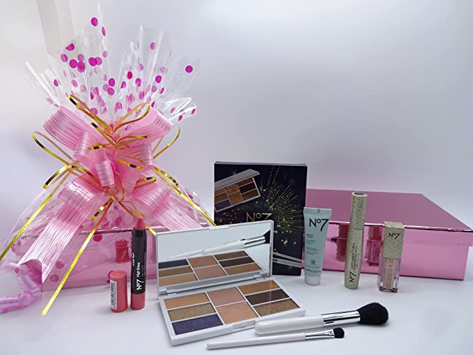 Complete No7 shimmer collection gift set, including makeup items and the elegant wrapped gift box in the background.