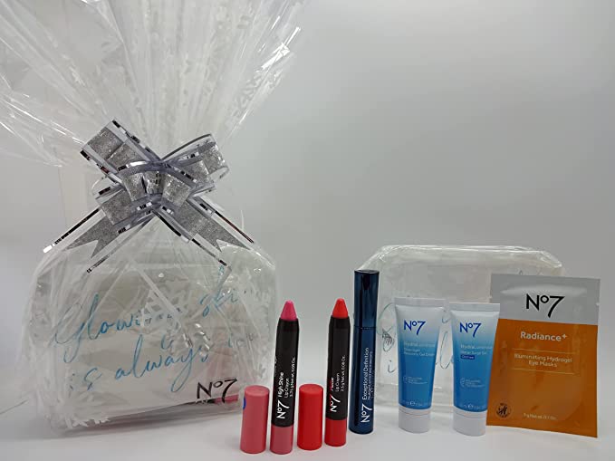 No7 6-piece Make Up and Skin Care beauty bundle wrapped with silver ribbon and snowflake-themed gift wrap.