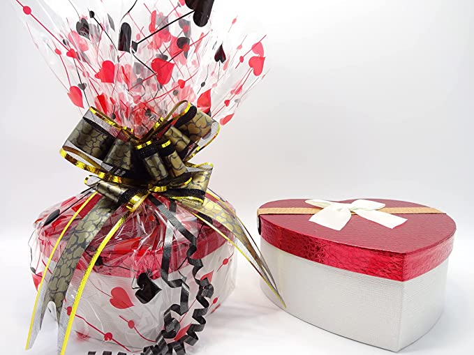 No7 Beauty Bundle with a festive black and gold ribbon, wrapped in love heart cellophane