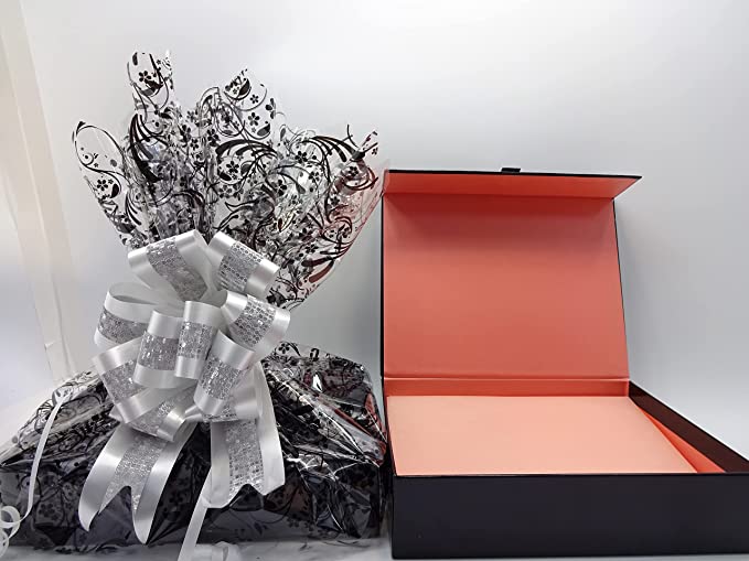 No7 beauty bundle gift box unwrapped, showing the interior packaging with coral lining.