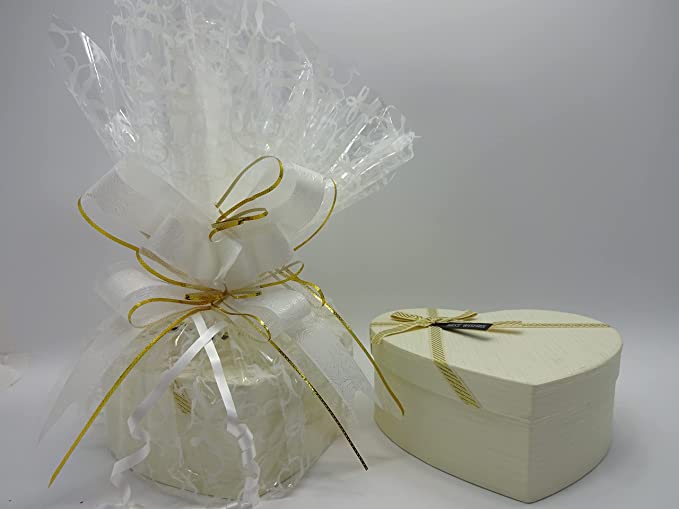 The No7 Luxury Beauty Hamper next to its matching white heart-shaped box with a delicate gold ribbon.