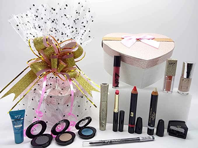 Complete set of the No7 Must-Have Beauty Bundle with the heart-shaped box and wrapped hamper, showcasing makeup and skincare products.